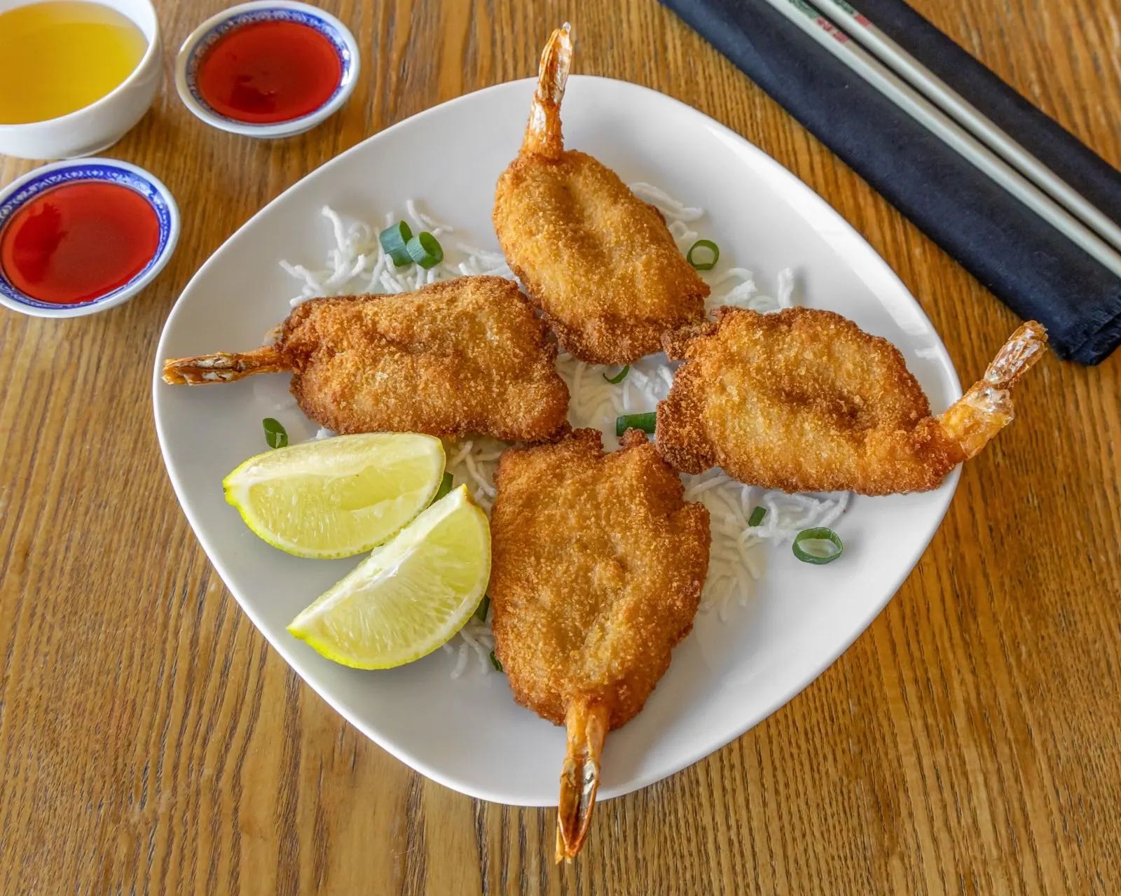 Crumbed king prawn cutlets with lemon