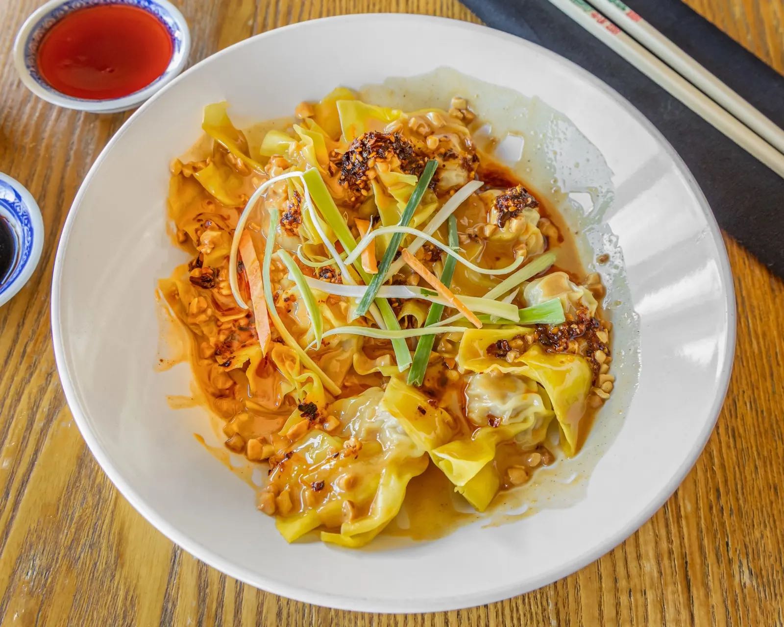 Wontons in hot chilli peanut sauce