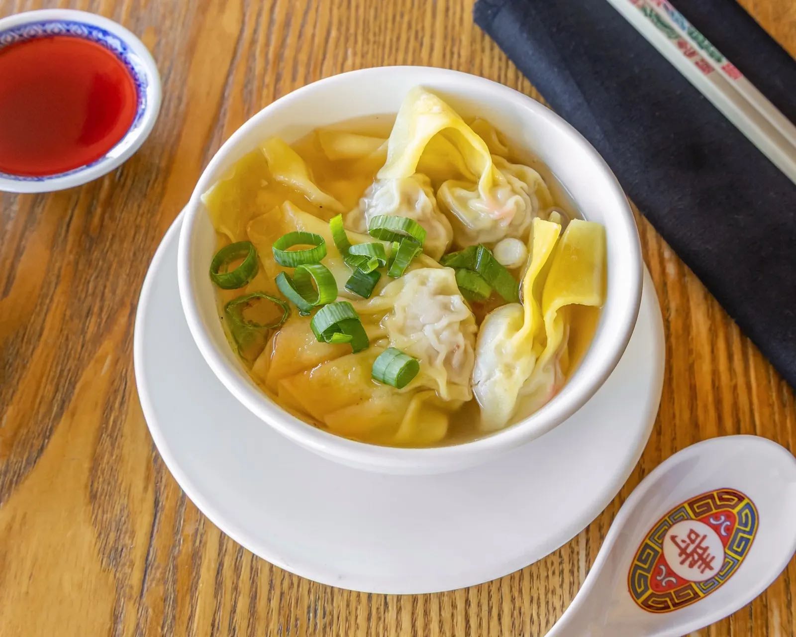 Short soup with handmade wontons and shallots